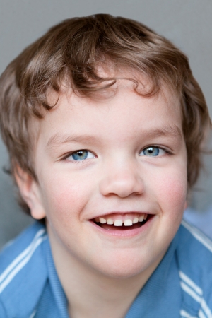 Portrait of smiling  merry boy, close up