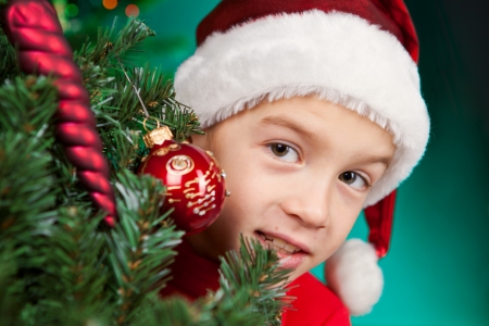 Happy small child in santa hatの写真素材