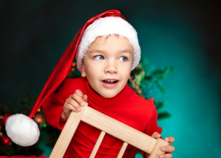 Happy small child in santa hatの写真素材