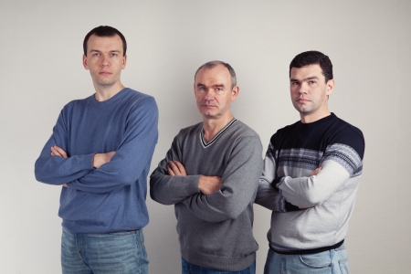 Portrait of father and two sons, studio