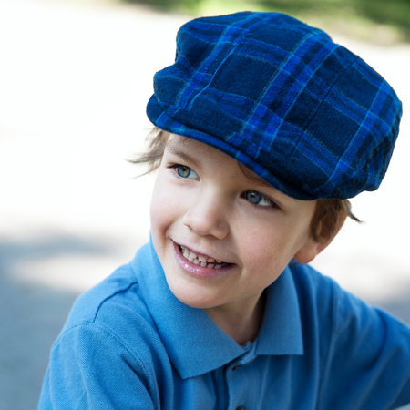 Closeup portrait of cute little boy laughingの写真素材