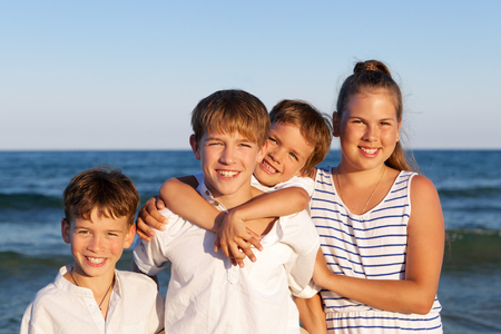 HAppy children are standing on beach, outdoorの写真素材