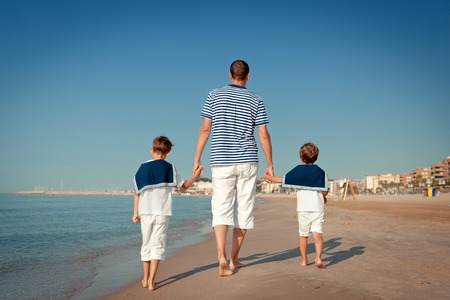 Portrait of happy family near sea, outdoorの写真素材