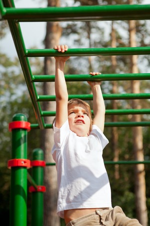 Child playing sports outdoors