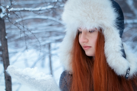 Portrait of beautiful girl in winter parkの写真素材