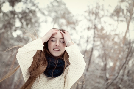 Portrait of beautiful girl in winter parkの写真素材