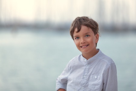 Portrait of happy boy on background of sea, outdoor, Spainの写真素材