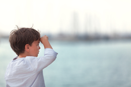 Portrait of happy boy on background of sea, outdoor, Spainの写真素材