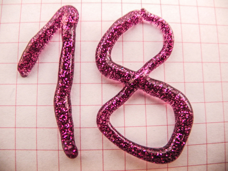 nuber 18 writen on a paper with shinny puprle colorの写真素材