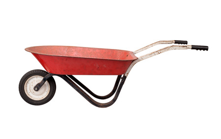 Antique Rusty Wheelbarrow isolated on whiteの写真素材