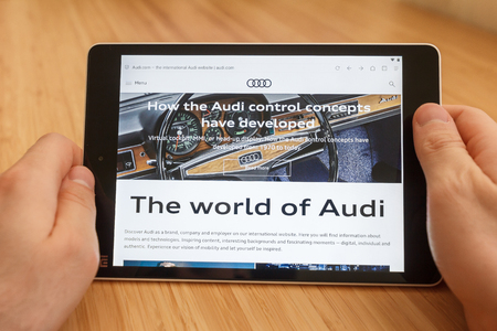 SAN FRANCISCO, US - 1 April 2019: Close up to hands holding tablet using internet and looking through Audi web site, in San Francisco, California, USA. An illustrative editorial imageのeditorial素材