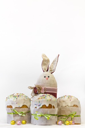 Orthodox Easter Cake With Chocolate Eggs and Easter Rabbit Toy Funny Bunny.の写真素材