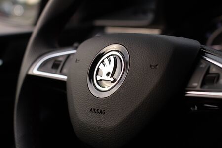 A Skoda logo on the steering wheel of a Rapid Monte Carlo - Mlada Boleslav, 01.12.2019,のeditorial素材