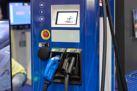 Modern electrical fast charger for electrical or hybrid PHEV automobiles. Future energy power. Ecology friendly charger. Clean ecology concept. Home electric car battery charger, PVA EXPO Prague, November 2019のeditorial素材