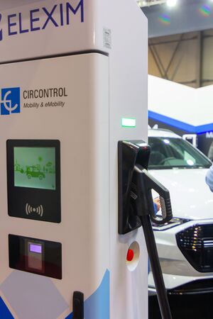 Modern electrical fast charger ELEXIM for electrical or hybrid PHEV automobiles. Future ecology friendly charger. Clean ecology concept. Home electric car battery charger, PVA EXPO Prague, November 2019のeditorial素材