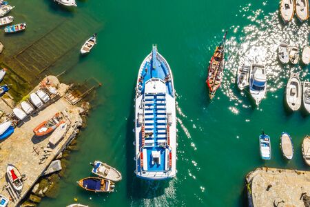 Cruise ship at harbor. Aerial view of beautiful yacht and boats in marina bay.の写真素材