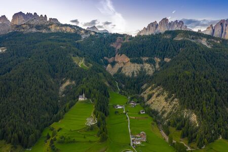 Aerial panoramic view of the Rosengarten group, Alps Mountains, Dolomites, Alto Adige, Italy.