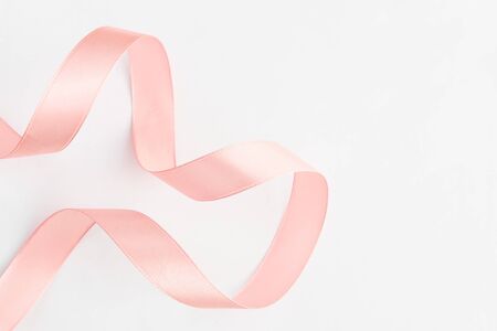 A Pink ribbon on a white backgroundの写真素材