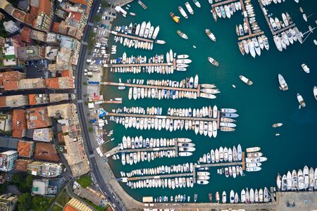 Top view on a harbor with moored sea ships, yachts and sailboats in Ligurian Sea. Santa Margherita...