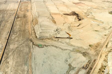 Top view of opencast coal mining quarry Natural texture.