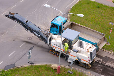 Cold milling machine removing asphalt pavement for repairing the roadのeditorial素材