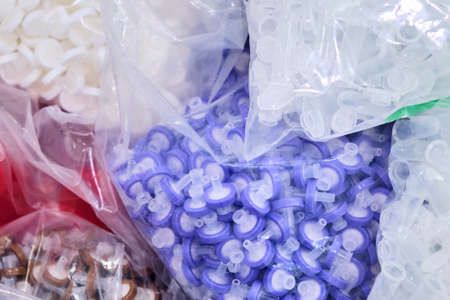 Purple, brown, white membrane filters and small plastic tubes for chemical and microbiological...
