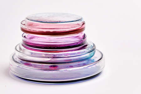 Pyramids from Petri dishes with colorful agar media with bacterial colonies for biochemical analysis in microbiological laboratoryの写真素材