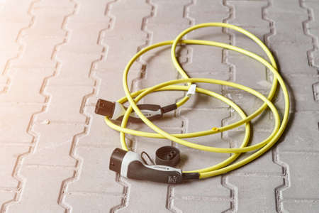 Electric car charging plug on the groundの写真素材