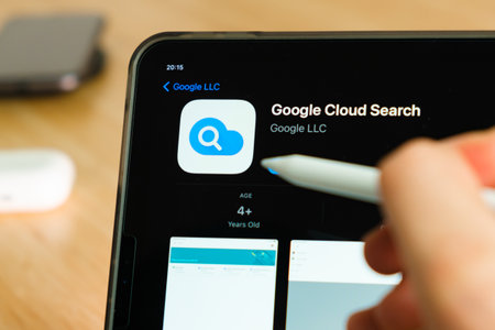 google cloud search logo shown by apple pencil on the iPad Pro tablet screen. Man using application on the tablet. December 2020, San Francisco, USA.のeditorial素材