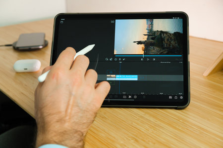 LumaFusion is used with apple pencil on iPad Pro tablet . Man using application on the tablet....