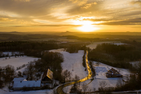 Panoramic view of amazing sunset in the countryside in winterの写真素材