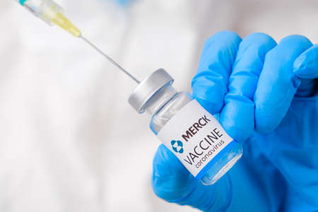 XXX vaccine against coronavirus collected into the syringe by health worker or doctor in protective gloves and PPE suit, April 2021, San Francisco, USAのeditorial素材