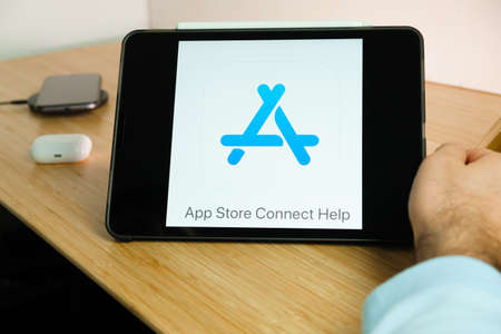 Apple App Store Connect Help logo on the screen of iPad tablet. March 2021, San Francisco, USA