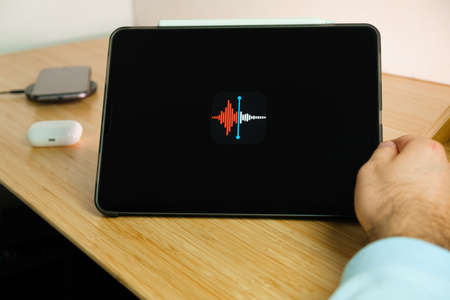 Apple â€ŽVoice Recorder logo on the screen of iPad tablet. March 2021, San Francisco, USA