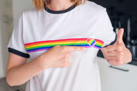 Woman in the T shirt with LGBT logo shows Like. Gay and lesbian rights concept. Tolerance of societyの写真素材