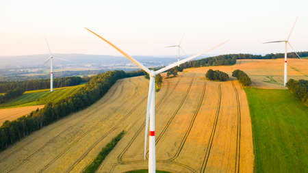Aerial view of wind turbines and windmills in the field. Alternative green electrical energy...