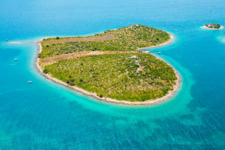 Aerial view of heart shape island Galesnjak in Dalamatia near Zadar, Croatia. Transparent and turquoise blue water of Adriatic seaの写真素材