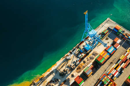 Aerial view of containers loading and unloading to the ship in the sea port. Logistic and transportation of goods. Crisis and shortage of containers in the world, September 2021, Georgia, USA.のeditorial素材