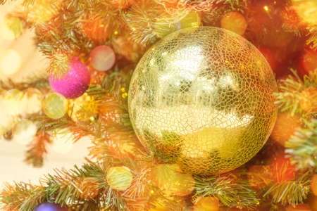 Christmas balls decorate Christmas tree with balls and garland lights with copy space. Preparation to the New Year.の写真素材
