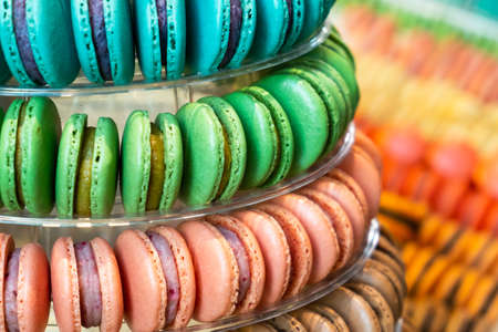Colorful delicious French macarons pyramid for the candy bar for wedding or happy birthday party, st...