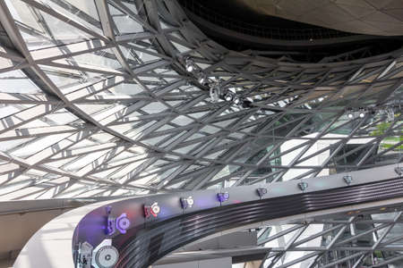 Inside of the hall in the building of BMW Welt, November 2021, Munich, Germany.
