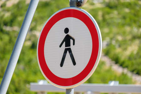Traffic sign prohibited entry for people depicting a walking person inside a red circle.の写真素材