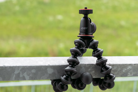 Flexible tripod Joby Gorillapod for recording movies on the fencing, September 2022, Prague, Czech Republic.のeditorial素材
