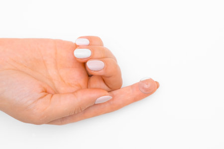 Close up woman hand holding a contact lens on the white background with copy space. Improvement in vision or changes in eye color concept.の写真素材