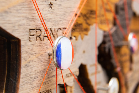 France flag pins and red thread for traveling and planning trips. Planning of logistics routes or spheres of influence in geopoliticsの写真素材