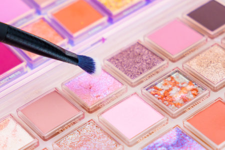 Top view of bright multicolor eyeshadow palette with brush.の写真素材