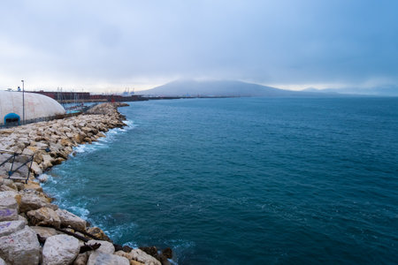Adriatic Sea and volcano Vesuvius in the distance covered with clouds in Naples.の写真素材