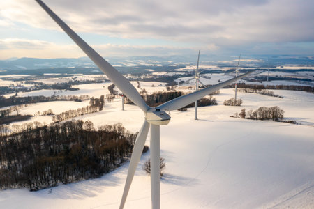 Wind turbines for production green electricity in a winter fieldの写真素材