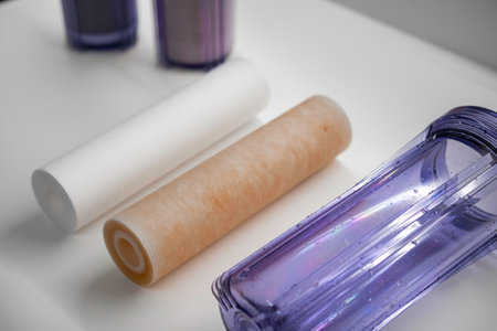 Close up filters and cartridges for replacement of dirty filters in water filtration reverse osmosis system in the kitchen.の写真素材