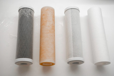 Dirty and clean filters in the reverse osmosis system on the table.